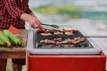 Image showing man cooking tasty food for french dinner party