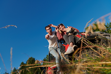 Image showing couple enjoying beautiful sunny day while driving a off road buggy