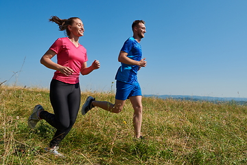 Image showing couple jogging in a healthy lifestyle on a fresh mountain air