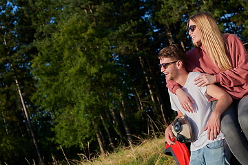 Image showing couple enjoying beautiful sunny day while driving a off road buggy