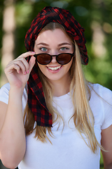 Image showing portrait of beautiful, emotional, young woman in sunglasses.