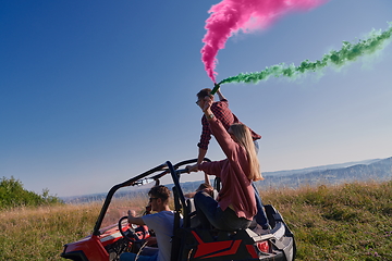 Image showing  colorful torches while driving a off road buggy car