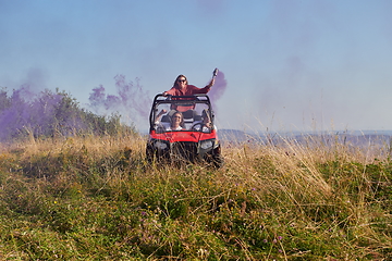 Image showing  colorful torches while driving a off road buggy car