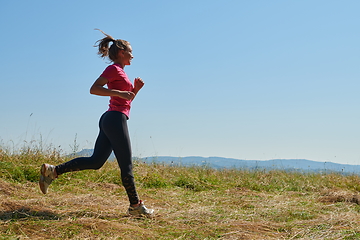 Image showing woman enjoying in a healthy lifestyle while jogging