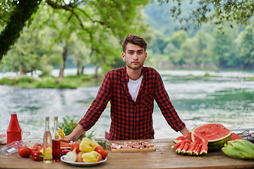 Image showing man cooking tasty food for french dinner party