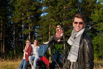 Image showing group young happy people enjoying beautiful sunny day while driving a off road buggy car