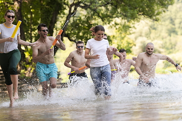 Image showing group of happy friends having fun on river