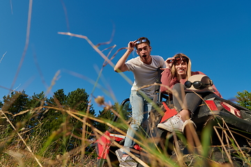 Image showing couple enjoying beautiful sunny day while driving a off road buggy