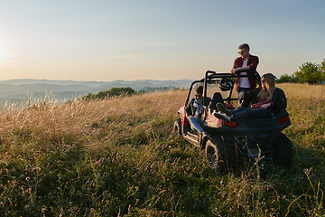 Image showing group young happy people enjoying beautiful sunny day while driving a off road buggy car