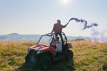 Image showing  colorful torches while driving a off road buggy car