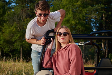 Image showing couple enjoying beautiful sunny day while driving a off road buggy