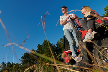 Image showing couple enjoying beautiful sunny day while driving a off road buggy