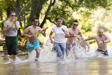 Image showing group of happy friends having fun on river