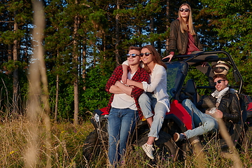 Image showing group young happy people enjoying beautiful sunny day while driving a off road buggy car