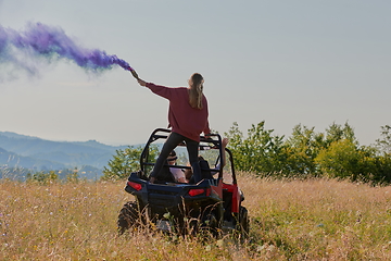 Image showing  colorful torches while driving a off road buggy car