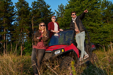 Image showing group young happy people enjoying beautiful sunny day while driving a off road buggy car