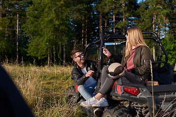 Image showing couple enjoying beautiful sunny day while driving a off road buggy