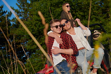 Image showing group young happy people enjoying beautiful sunny day while driving a off road buggy car