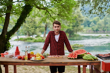 Image showing man cooking tasty food for french dinner party