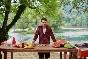 Image showing man cooking tasty food for french dinner party