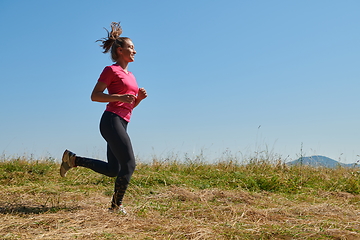 Image showing woman enjoying in a healthy lifestyle while jogging