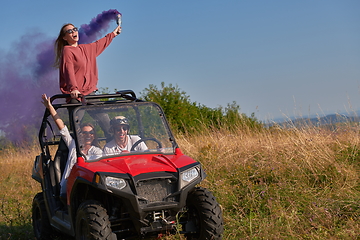 Image showing  colorful torches while driving a off road buggy car