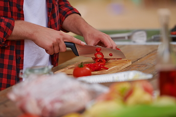 Image showing man cooking tasty food for french dinner party