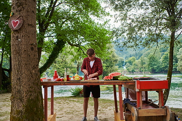 Image showing man cooking tasty food for french dinner party