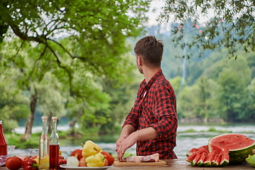 Image showing man cooking tasty food for french dinner party