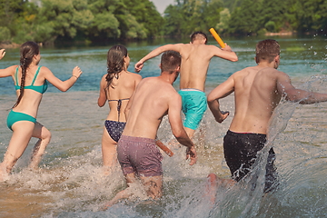 Image showing group of happy friends having fun on river