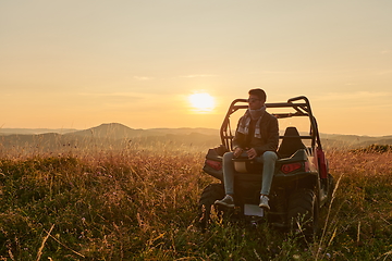 Image showing man enjoying beautiful sunny day while driving a off road buggy car