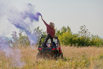 Image showing  colorful torches while driving a off road buggy car