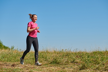 Image showing woman enjoying in a healthy lifestyle while jogging