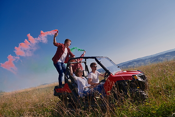 Image showing  colorful torches while driving a off road buggy car