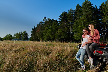 Image showing couple enjoying beautiful sunny day while driving a off road buggy