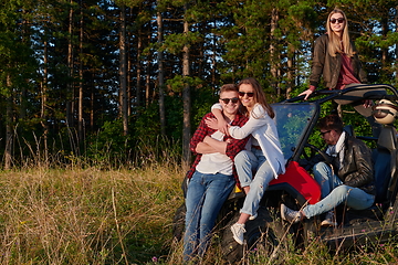 Image showing group young happy people enjoying beautiful sunny day while driving a off road buggy car