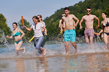 Image showing group of happy friends having fun on river