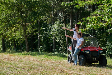 Image showing couple enjoying beautiful sunny day while driving a off road buggy