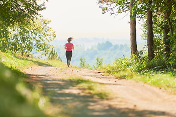 Image showing woman enjoying in a healthy lifestyle while jogging