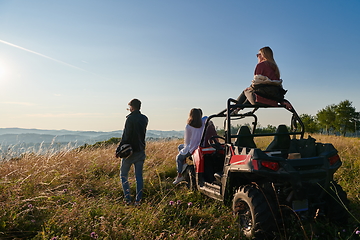 Image showing group young happy people enjoying beautiful sunny day while driving a off road buggy car