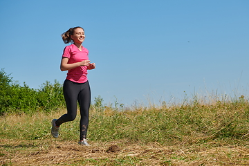 Image showing woman enjoying in a healthy lifestyle while jogging