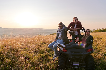 Image showing group young happy people enjoying beautiful sunny day while driving a off road buggy car