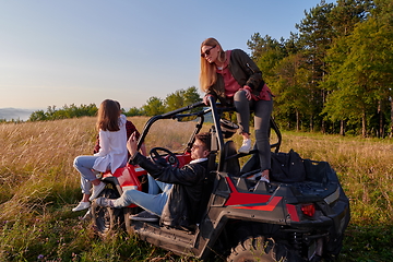 Image showing group young happy people enjoying beautiful sunny day while driving a off road buggy car