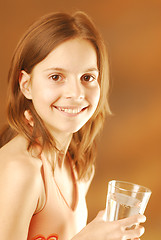 Image showing A girl with a glass of water