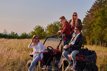 Image showing group young happy people enjoying beautiful sunny day while driving a off road buggy car