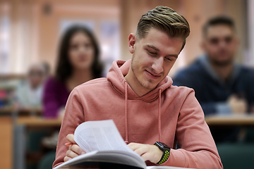 Image showing student taking notes while studying in high school