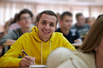 Image showing student taking notes while studying in high school