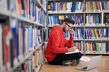 Image showing the students uses a notebook, laptop and a school library