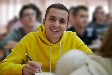 Image showing student taking notes while studying in high school