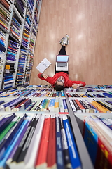 Image showing the students uses a notebook, laptop and a school library